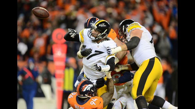 Denver Broncos linebacker DeMarcus Ware, bottom, sacks Pittsburgh quarterback Ben Roethlisberger during an NFL playoff game in Denver on Sunday, January 17. Roethlisberger was ruled down before he shoveled the ball away. The Broncos advanced to the AFC Championship with a 23-16 victory.