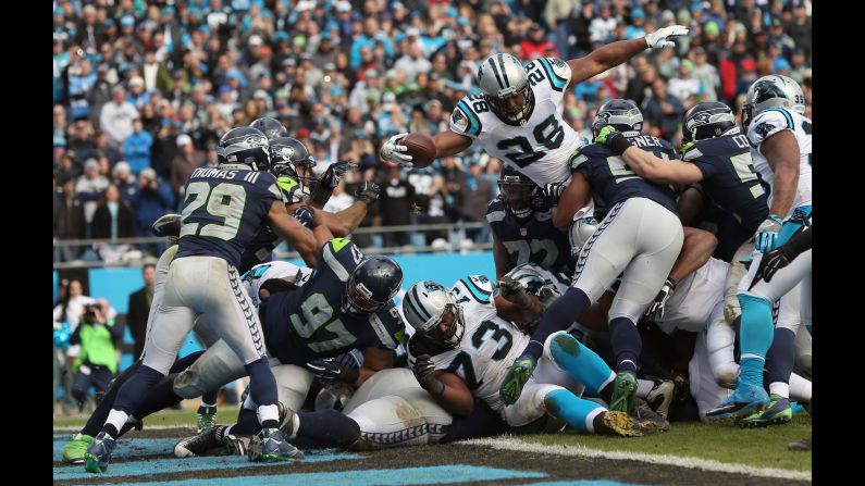 Carolina running back Jonathan Stewart leaps over the goal line during the Panthers' 31-24 victory over Seattle on Sunday, January 17. Carolina, which has lost only one game this season, will host Arizona in the NFC Championship game. 