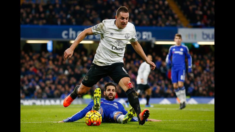 Everton defender Phil Jagielka, foreground, is tackled by Chelsea's Cesc Fabregas during a Premier League match in London on Saturday, January 16.