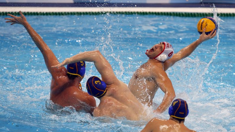 Montenegro's Aleksandar Radovic prepares to shoot against Spain during a water polo match in Belgrade, Serbia, on Tuesday, January 12. 