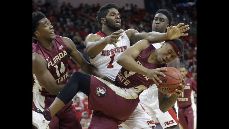 Florida State's Benji Bell, foreground, collides with North Carolina State's Lennard Freeman during a game in Raleigh, North Carolina, on Wednesday, January 13.