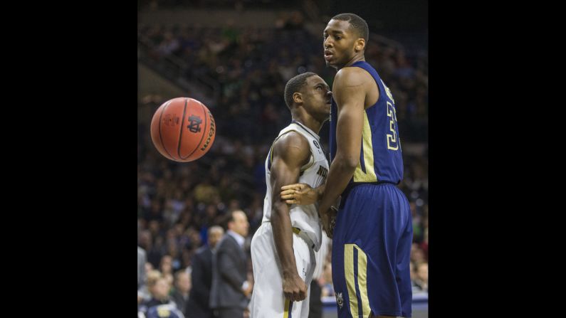 Notre Dame's Demetrius Jackson, left, looks at Georgia Tech's James White after dunking the ball Wednesday, January 13, in South Bend, Indiana.