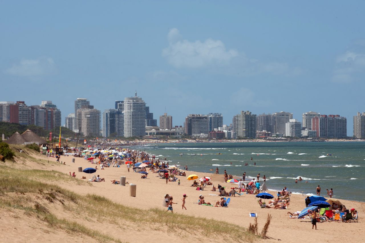 Tourists enjoy the sun on Punta del Este's La Mansa beach. Temperatures can climb as high as 40 C in December to February, while July to September are the coldest months. 
