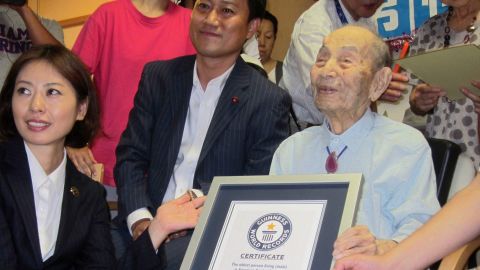 Yasutaro Koide, 112, receives a Guinness World Records certificate as the oldest living man in August.