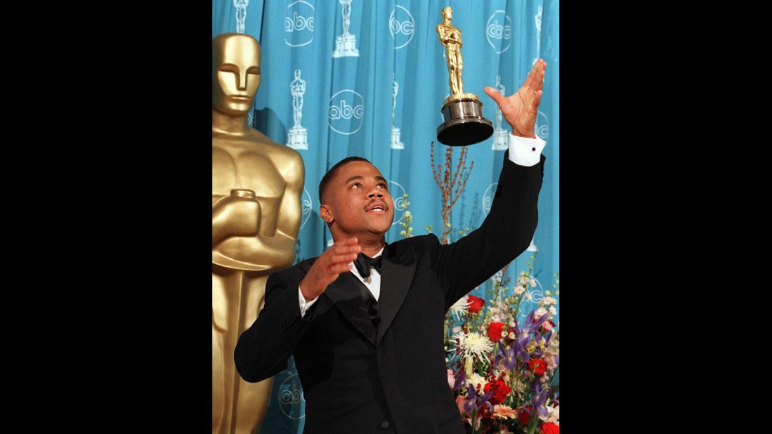 Cuba Gooding Jr. throws his Oscar into the air after being named best supporting actor for his role in "Jerry Maguire" in 1997. 
