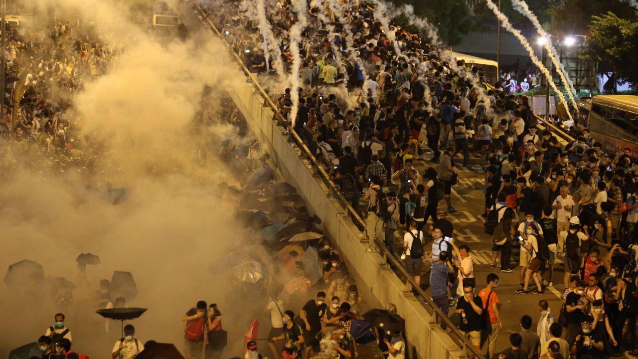 Police fire tear gas upon pro-democracy demonstrators near the Hong Kong government headquarters on September 28, 2014.