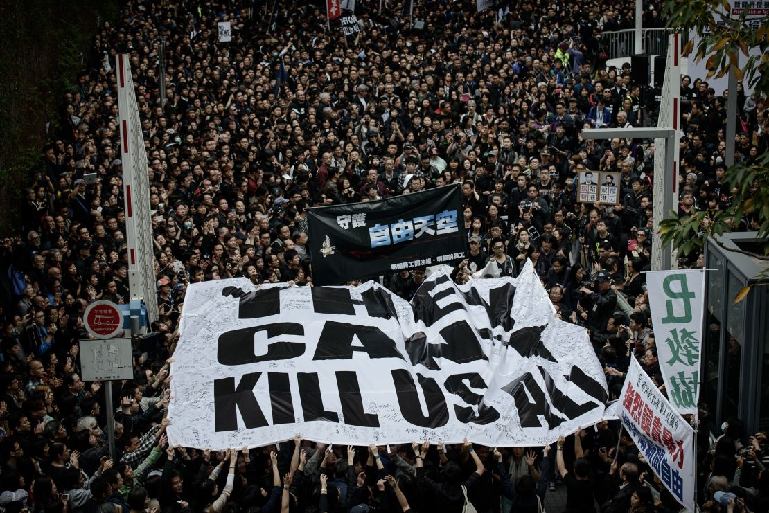 Protesters display a large banner during a rally to support press freedom in Hong Kong on March 2, 2014.