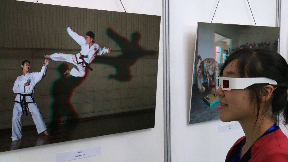 A visitor observes a 3D photo at the 3DPRK exhibition in Pyongyang, North Korea