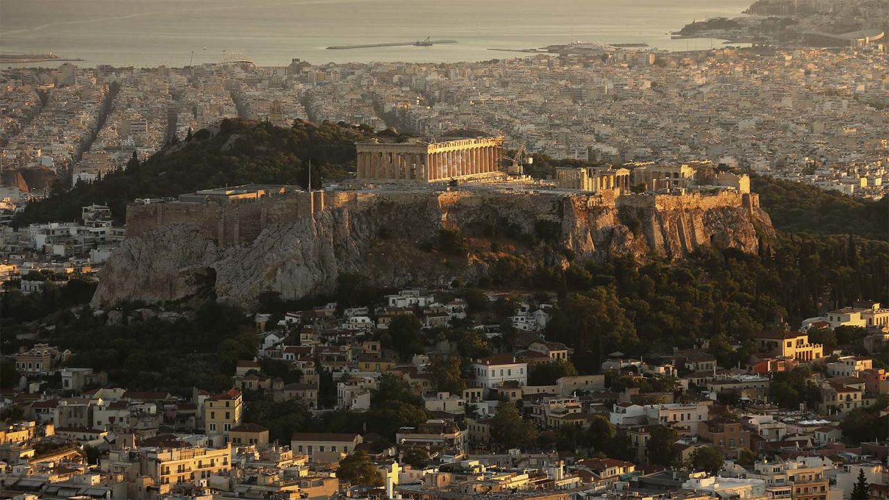 Adjacent to The Acropolis, pictured, Koukaki sits at the bottom of the Lofos Filopappou and is home to some ancient treasures of its own. "After it became a pedestrian playground, the street morphed to have a cafe-like feel with all of the restaurants and bars placing tables and chairs outside," says the Airbnb report.  