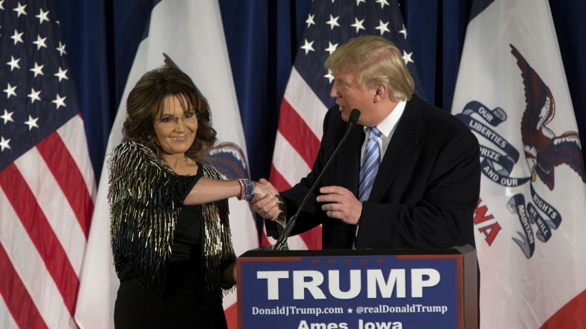 Republican presidential candidate Donald Trump shakes hands with former Alaska Gov. Sarah Palin at Hansen Agriculture Student Learning Center at Iowa State University on January 19, 2016 in Ames, IA.