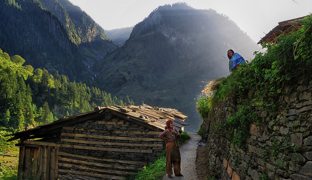 Bara Bangal's age shows everywhere, from the huts, to the trails through the village, and the walls that keep the mountainside from caving in. Here, two women chat while keeping a lookout for movement on the mountains that could be their husbands leading their flock back to the village.