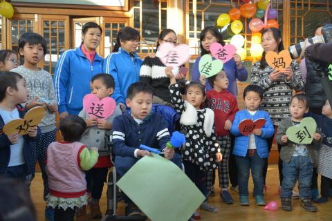 Jason's friends and nannies from Alenah's Home orphanage in Beijing throw a farewell party for him on January 9, 2016. In China, he was known as JiaJia. The signs read: "Farewell to JiaJia, going to his parents." This is the moment they've anticipated and dreaded; saying goodbye to a boy many at the home consider their older brother.