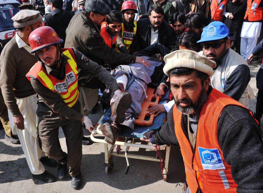 Rescue workers transport a wounded man to a hospital following an attack by gunmen on Bacha Khan University in Charsadda, Pakistan, on Wednesday, January 20.