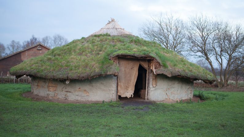 Scientists are excavating the best-preserved Bronze Age village ever found in the UK, located in the marshlands of eastern Britain, at a site dubbed Must Farm. Pictured is a replica of a Bronze Age house that shares similarities with two ancient dwellings at the site, which stood on stilts.