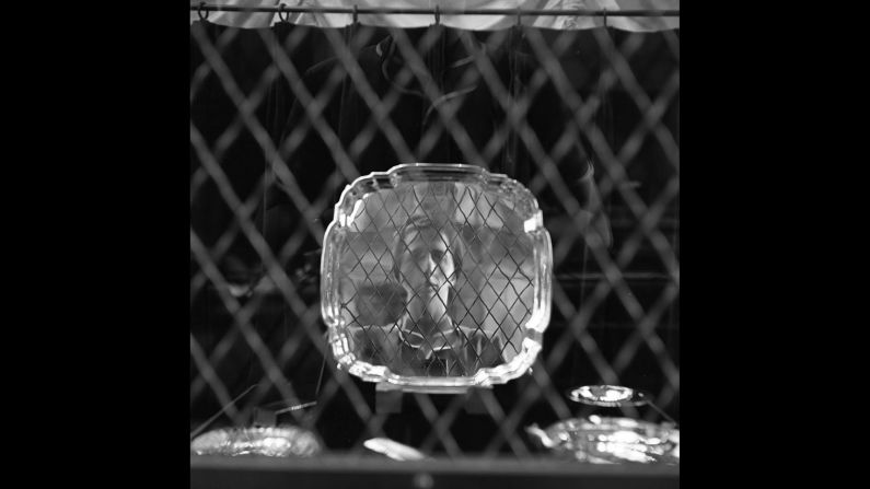 Maier photographs her reflection in a mirror in 1954. Her work was discovered in 2007 by John Maloof, a 26-year-old real estate agent who bid on a box of negatives at an auction house in Chicago. Maloof eventually amassed more negatives, prints and undeveloped rolls of film.