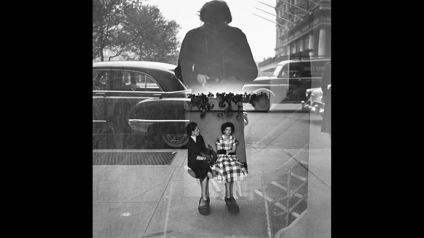 Maier photographs herself in what appears to be a glass window in 1954. However, there's more. Who are those other two women we see? And where exactly are they -- on the inside somewhere, or maybe on the outside? This kind of fantastical and imaginative element is characteristic of Maier's images, leading viewers' minds down a path of endless curiosities.