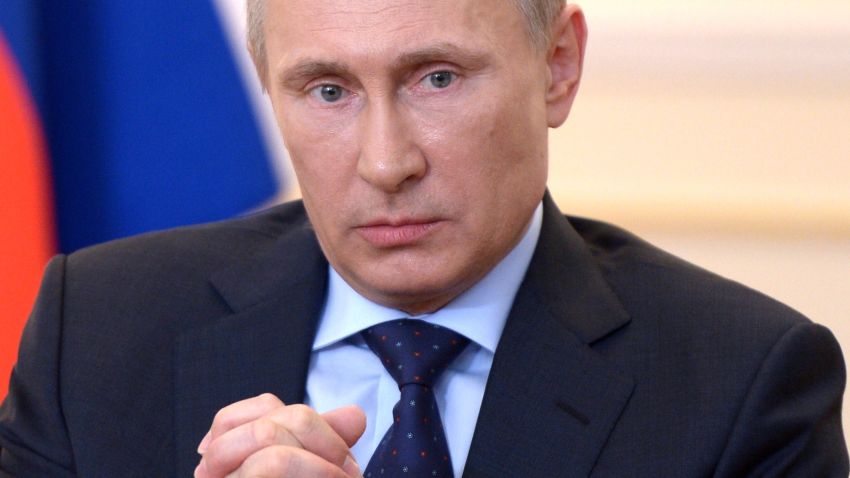 Russian President Vladimir Putin looks on during a press conference in his country residence of Novo-Ogaryova outside Moscow on March 4, 2014.