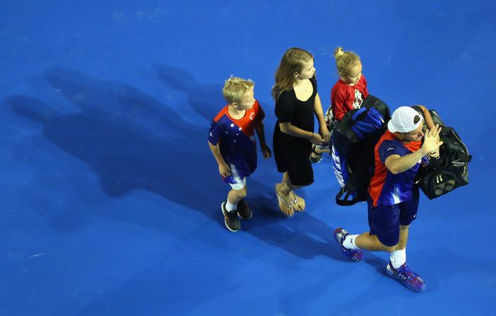 Lleyton Hewitt bid a fond farewell to the Australian Open crowd as he left the stadium with his family. 