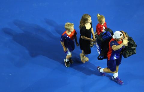 Lleyton Hewitt bid a fond farewell to the Australian Open crowd as he left the stadium with his family. 