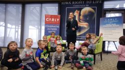 Republican presidential candidate Carly Fiorina is surrounded by preschool students as she speaks during the Iowa Right to Life Presidential Forum on Jan. 20, 2016, in Des Moines, Iowa.
