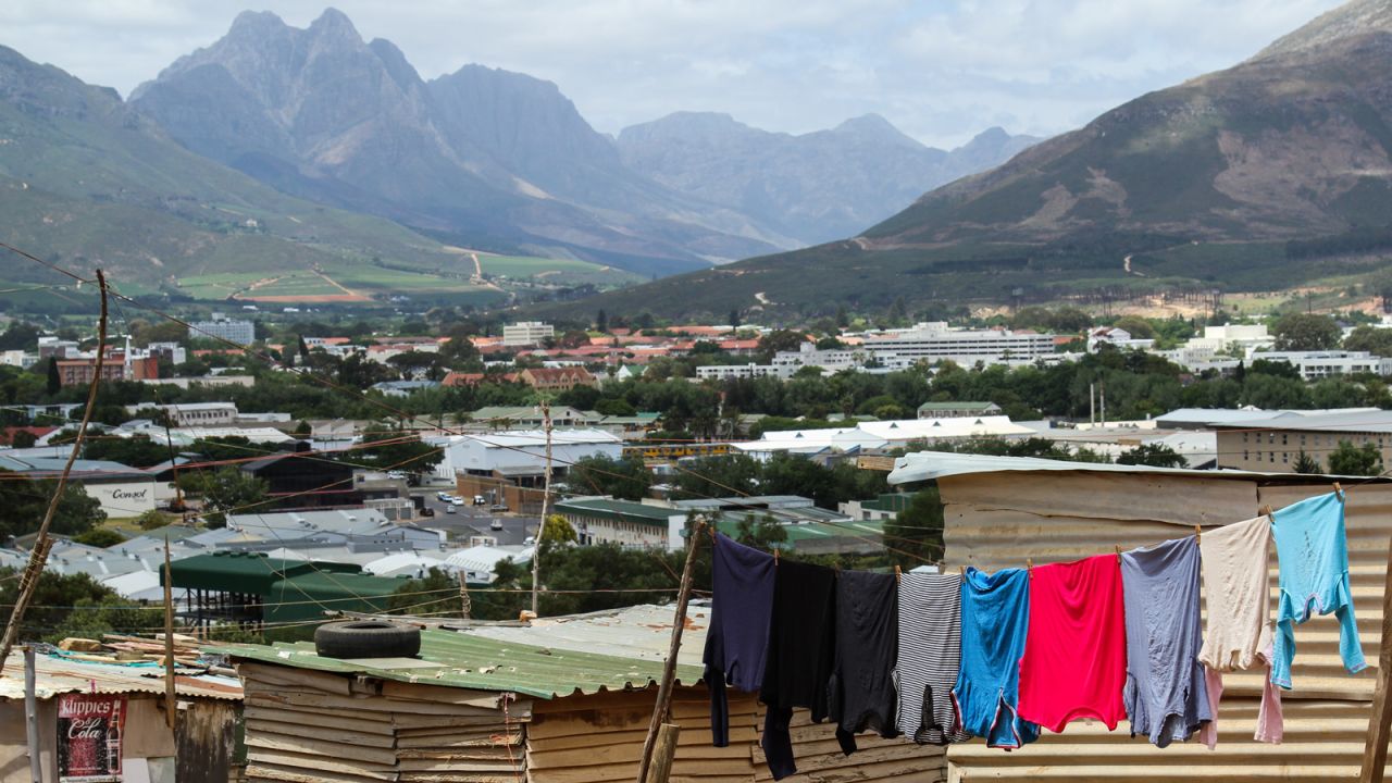 Enkanini is Cape Town's largest informal settlement. The lack of basic amenities contrasts with the natural bounty of the fertile rolling hills of the Cape Winelands.  