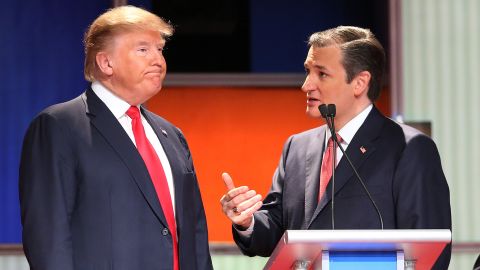 Republican presidential candidates (L-R) Donald Trump and Sen. Ted Cruz (R-TX) speak during a commercial break in the Fox Business Network Republican presidential debate at the North Charleston Coliseum and Performing Arts Center on January 14, 2016 in North Charleston, South Carolina.