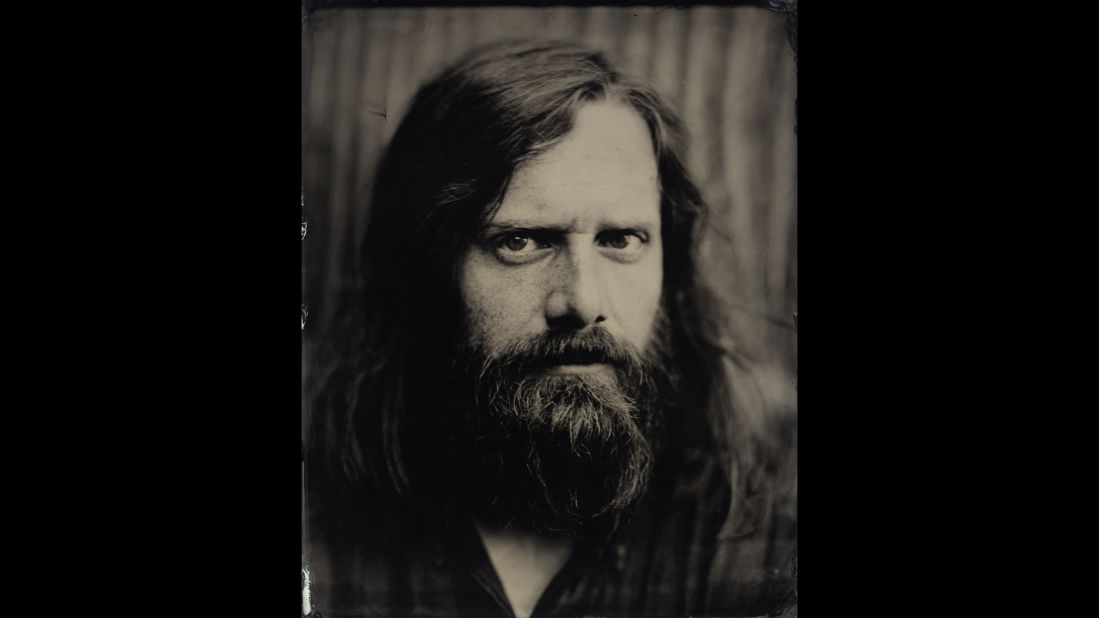 Ben Townsend poses for a portrait. Tintype photography requires a large amount of light, and subjects must remain still during long exposures.