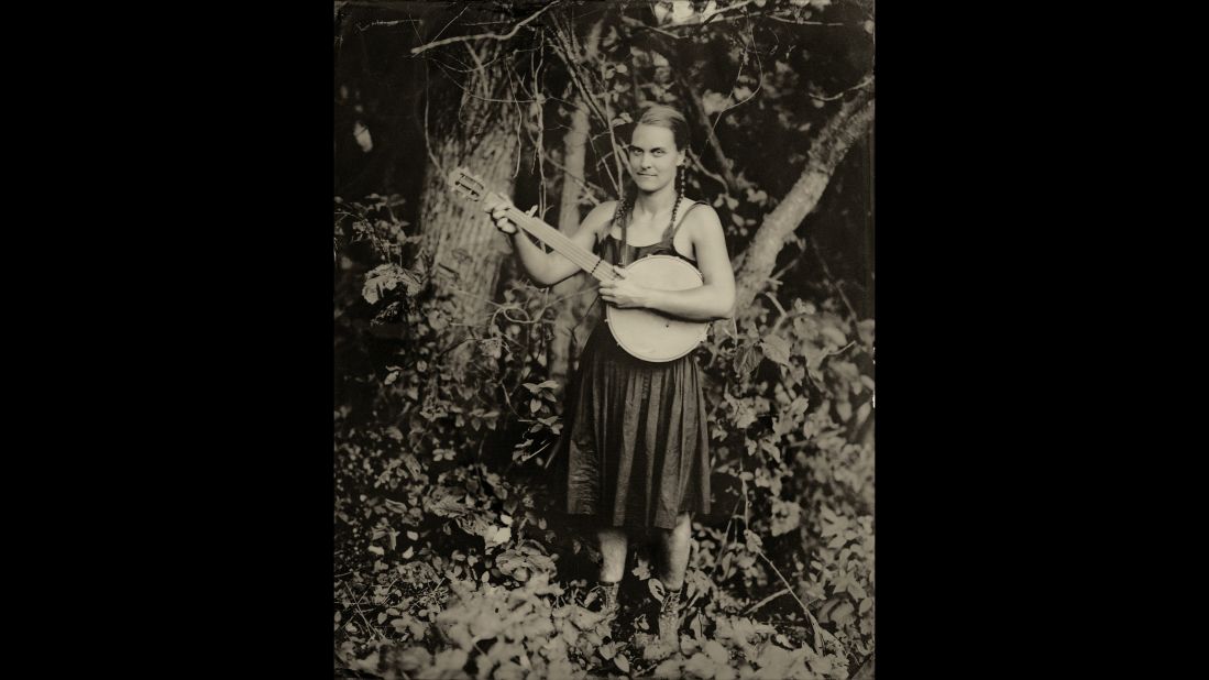 Hannah Johnson holds her instrument. "I generally go to the musician's house," Elmaleh said. "The land, to me, is equally as important a character in the documentation of this music. I photograph them in their own landscape."