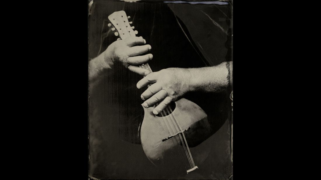 A closeup shot of Pat Shields and his mandolin.