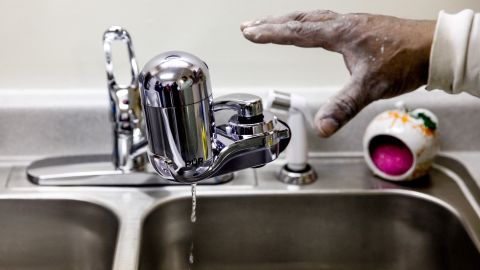 A water filter gets installed last month in a home in Flint, Michigan, as the city battles a toxic water crisis.