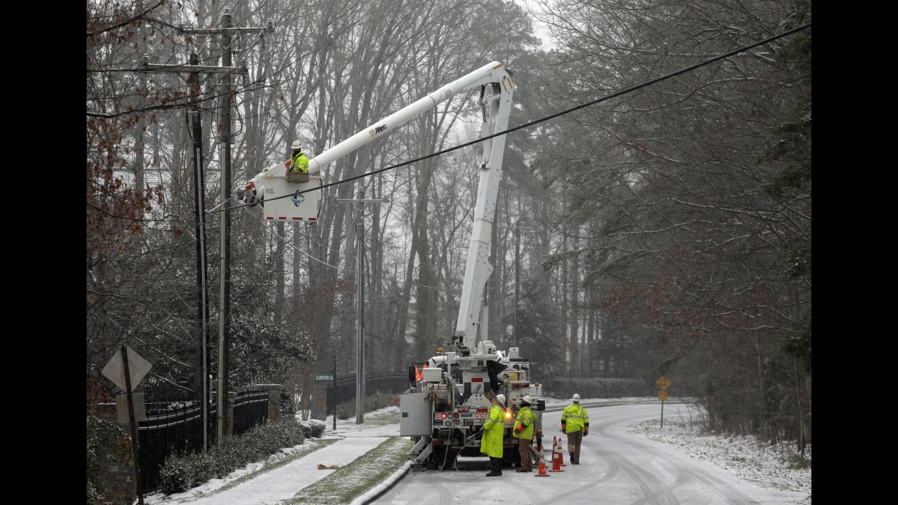 Duke Energy employees work to restore power in Matthews, North Carolina, on January 22.