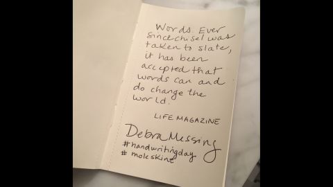 Actress Debra Messing copies an inspiring quote on the written word from "Life" magazine.