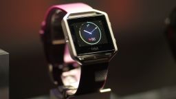 The new FitBit Blaze is seen at a press conference on CES Press Day, January 5, 2016 in Las Vegas, Nevada ahead of the CES 2016 Consumer Electronics Show. Fitbit on January 5unveiled its "smart fitness watch," aiming to get into the growing smartwatch segment with upgraded fitness tracking features. The company, which leads the wearable tech market with its wrist-worn trackers but is being challenged by the rise of smartwatches from Apple and others, said its $199 Fitbit Blaze watch was available for pre-order and would be in retail stores globally in May. AFP PHOTO / DAVID MCNEW / AFP / DAVID MCNEW        (Photo credit should read DAVID MCNEW/AFP/Getty Images)