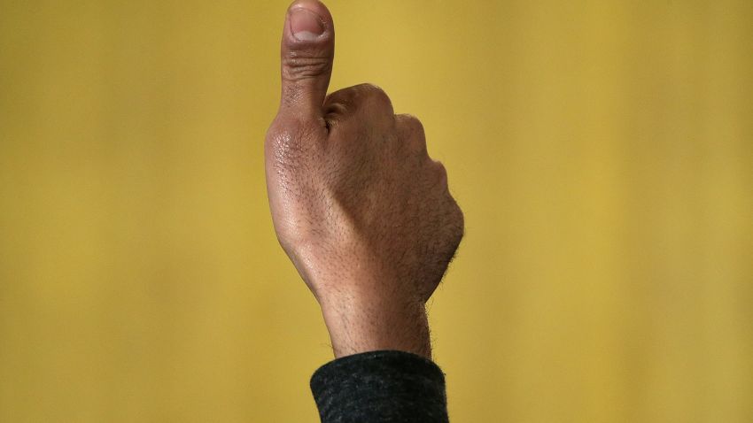 WASHINGTON, DC - FEBRUARY 26:  A guest gives a thumbs up sign as U.S. President Barack Obama delivers remarks during an event in the East Room of the White House on February 26, 2015 in Washington, DC. Obama paid tribute to African American heroes of the civil rights movement during a reception marking Black History Month.  (Photo by Win McNamee/Getty Images)
