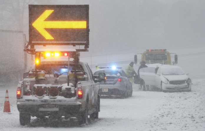 An accident victim near Richmond removes belongings from a car along Interstate 95 on January 22. 