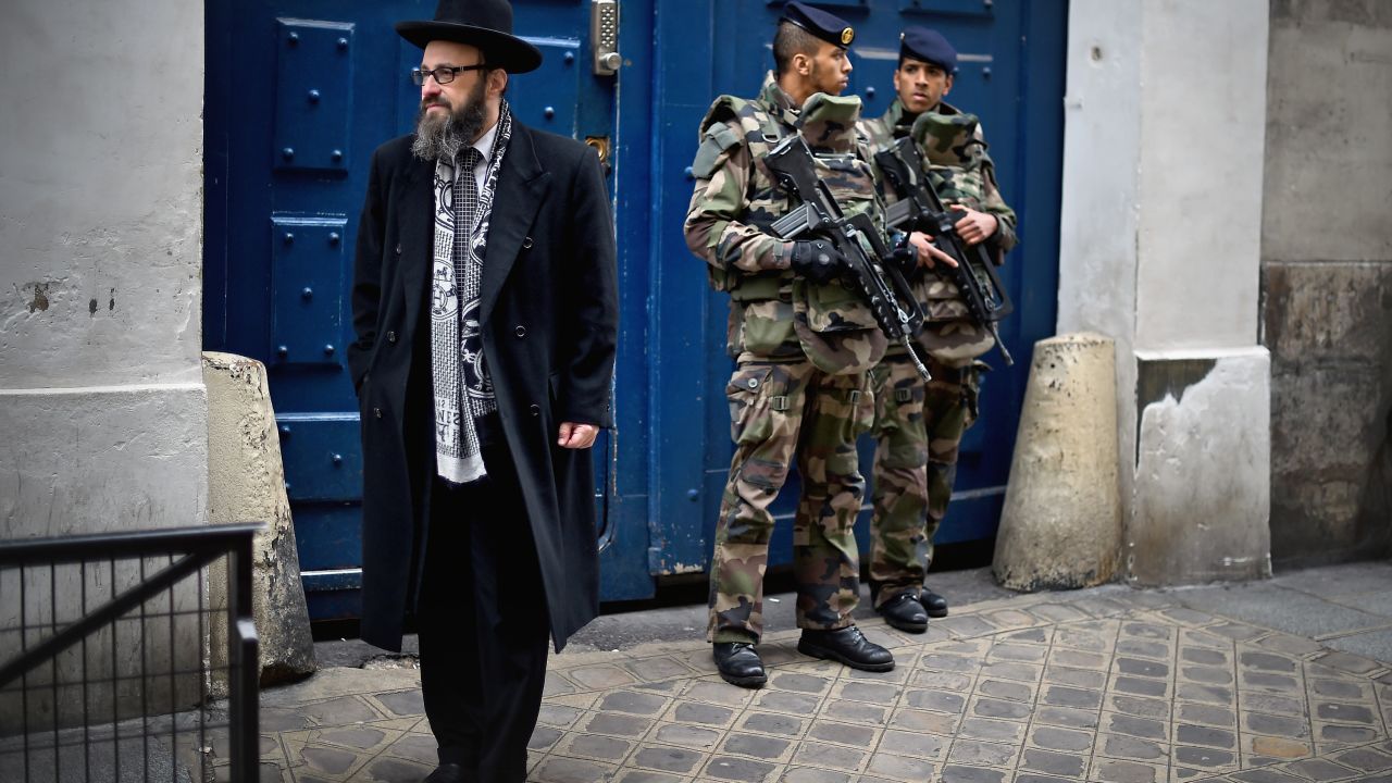 Armed soldiers patrol a school in the Jewish quarter of Paris following the kosher market attack in January 2015.