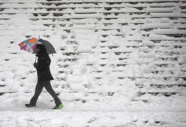 A man walks by Federal Hall in New York on January 23.