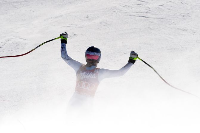 Vonn raises her arms after crossing the finish line at Cortina d'Ampezzo.