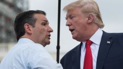 US Republican presidential candidate Donald Trump (R) is greeted on stage by fellow Republican candidate Ted Cruz before speaking at a rally organized by the Tea Party Patriots against the Iran nuclear deal in front of the Capitol in Washington, DC, on September 9, 2015.