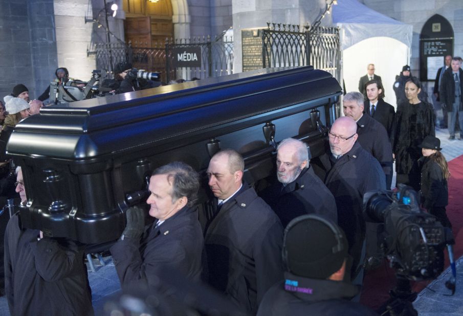 Dion walks behind her husband's casket following the funeral services. The family will host a public memorial for fans in Las Vegas on February 3, at Caesars Palace Colosseum. 