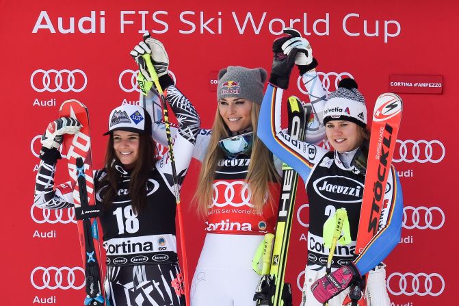 Vonn is flanked by Tina Weirather of Liechtenstein and Viktoria Rebensburg of Germany on the podium after her super-G victory at Cortina.