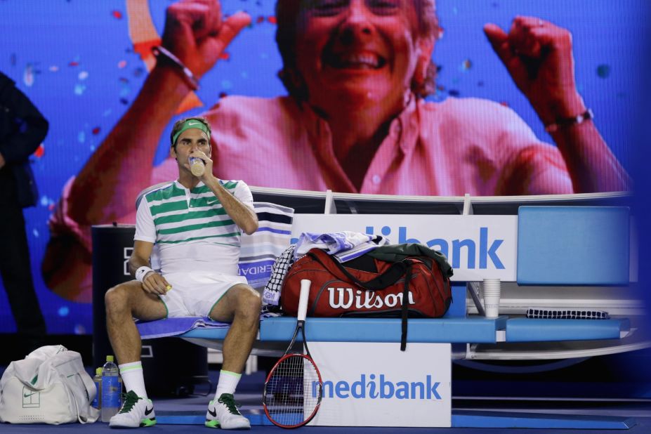 Third seed Roger Federer takes a break during his straight sets rout of David Goffin of Belgium to reach the last 16.