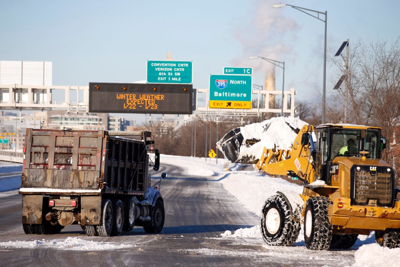 Crews work to remove the snow from a highway in Washington on January 24. 
