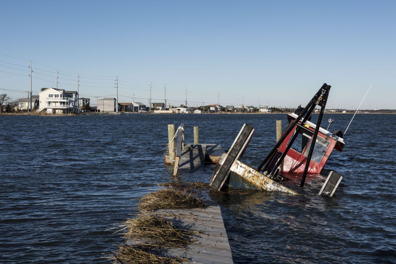 A boat is partly submerged in high water in Middle Township, New Jersey, on January 24. 