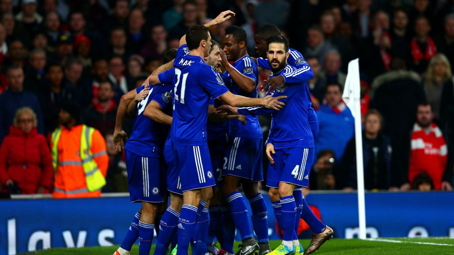Diego Costa is mobbed by teammates after scoring the only goal of the game in the 1-0 win for Chelsea over Arsenal at the Emirates.