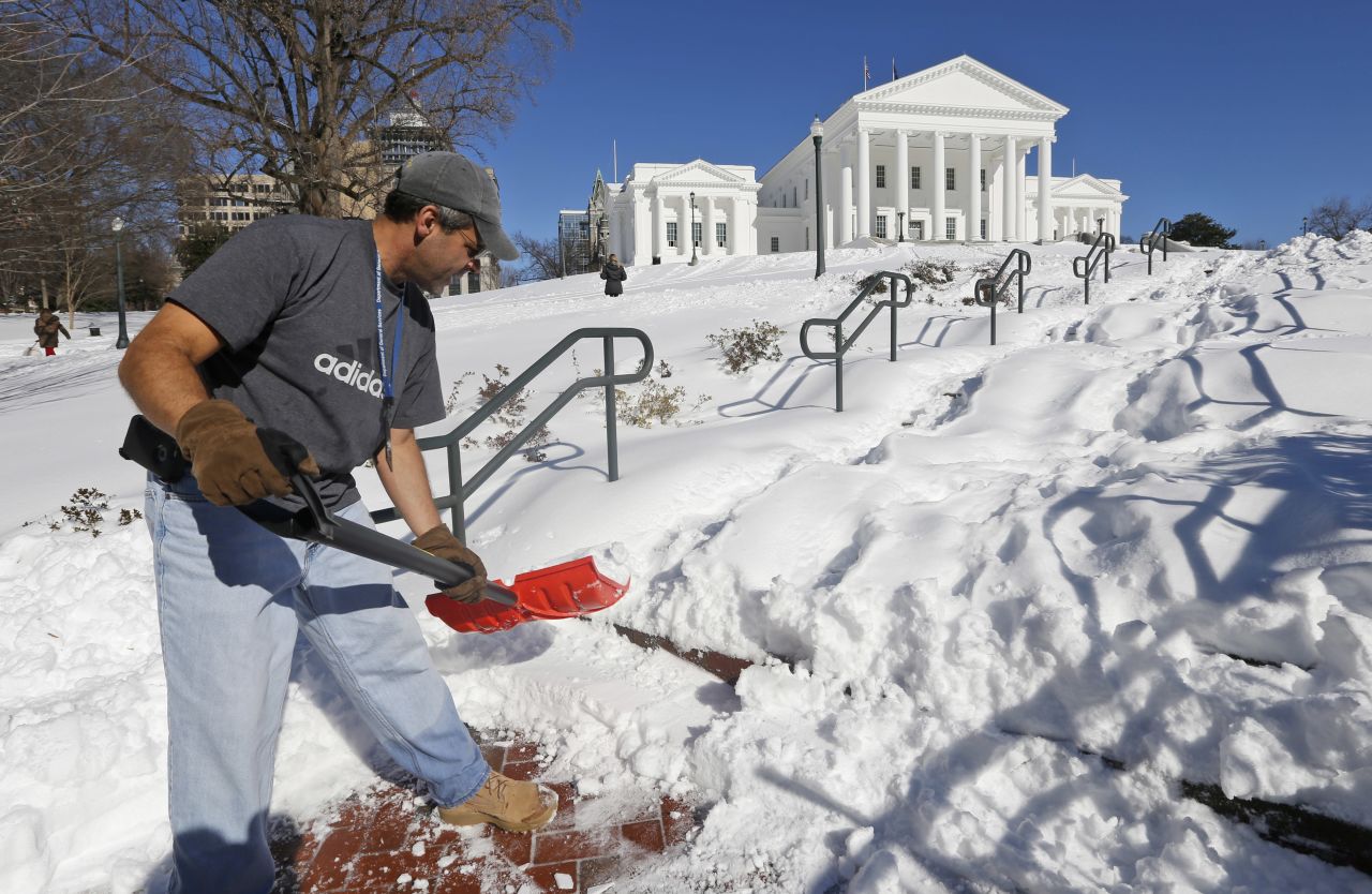 Joe Damico, deputy director of the Virginia Department of General Services, shovels a walkway to the State Capitol in Richmond, Virginia, on January 24. 