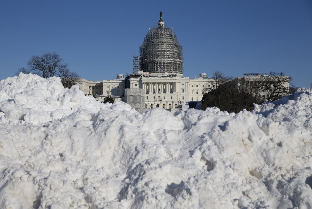 Snow is piled in front of the U.S. Capitol on January 24.