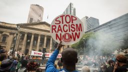 MELBOURNE, AUSTRALIA - NOVEMBER 27:  A man shows his support at the Rally protesting the forced closures of Indigenous communities in Western Australia, at the State Library on November 27, 2015 in Melbourne, Australia.  (Photo by Chris Hopkins/Getty Images)