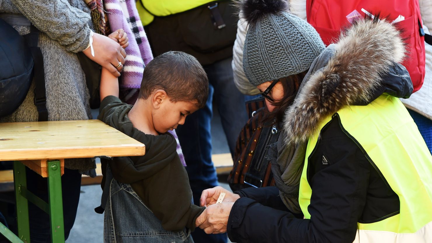 Migrants are issued wristbands after arriving at the Austrian-German border in October.