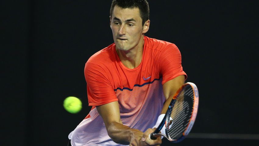 MELBOURNE, AUSTRALIA - JANUARY 25:  Bernard Tomic of Australia plays a backhand in his fourth round match against Andy Murray of Great Britain during day eight of the 2016 Australian Open at Melbourne Park on January 25, 2016 in Melbourne, Australia.  (Photo by Scott Barbour/Getty Images)